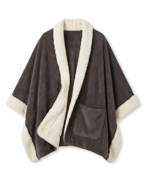 The Reader's Wrap laid flat on white: charcoal grey fleece front, cream sherpa lining and border, front patch pocket