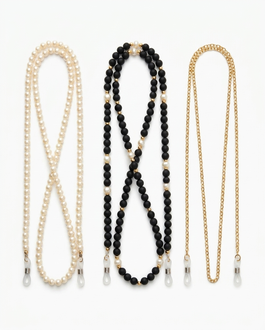 All three eyeglass chains on white: pearl, black and gold beaded, fine gold link, with silicone end loops
