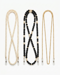 All three eyeglass chains on white: pearl, black and gold beaded, fine gold link, with silicone end loops