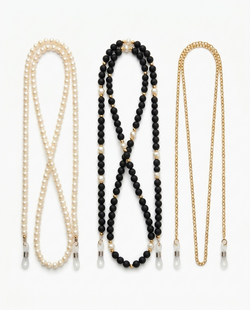 All three eyeglass chains on white: pearl, black and gold beaded, fine gold link, with silicone end loops